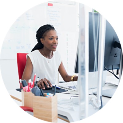 Woman in office working on computer at desk