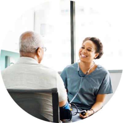 Nurse taking patient's blood pressure