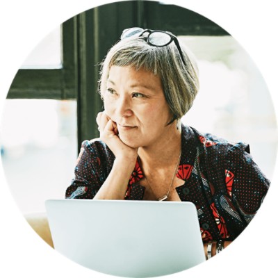 Woman sitting in front of laptop