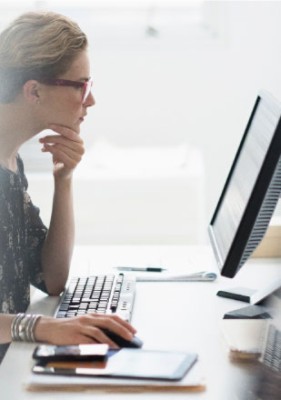 Woman working at desktop computer