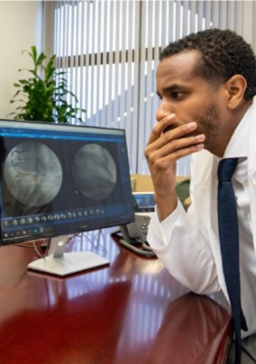 Man looking at computer monitor