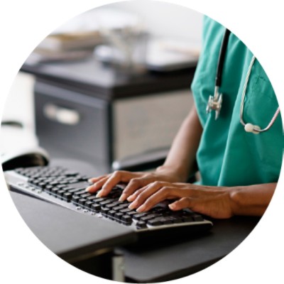 Doctor using computer keyboard