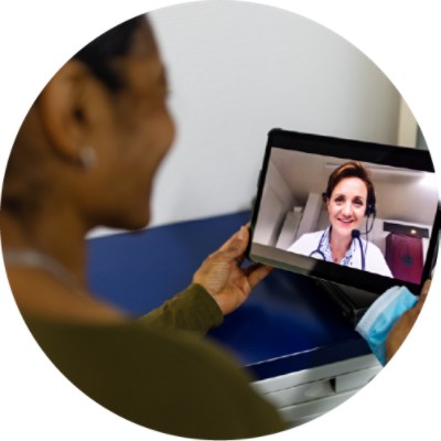 Woman talking to Doctor via tablet