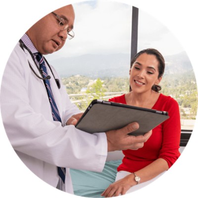 Doctor showing tablet to patient