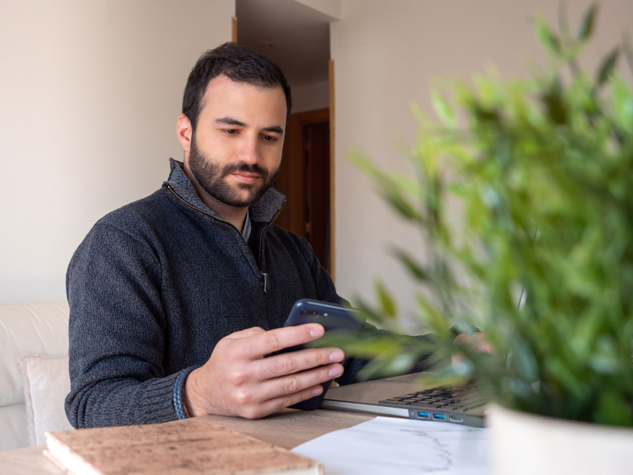 Concentrated man working remote at home