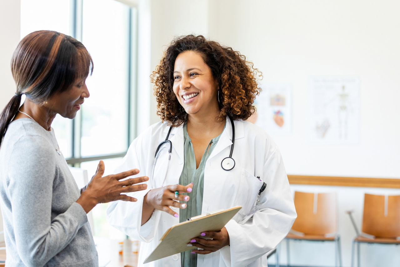 Female doctor and patient talking, healthcare and medicine, consultation.