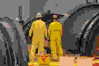 men inspecting turbine
