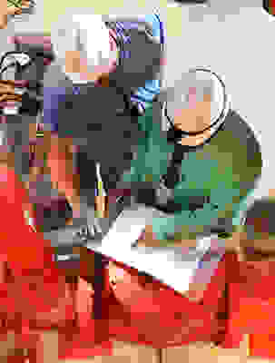 Employees, inspecting equipment