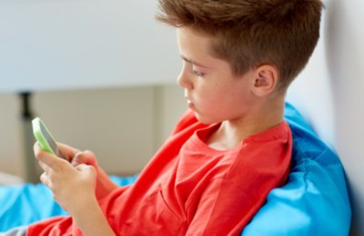 Kid playing on phone