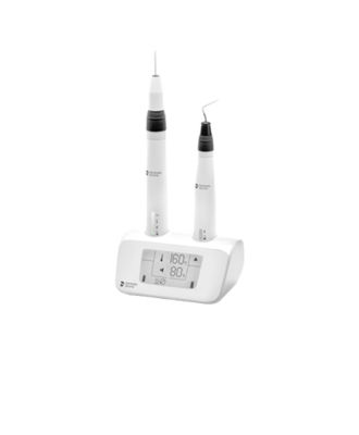 Cordless obturation device Gutta-Smart with handpieces and base unit.