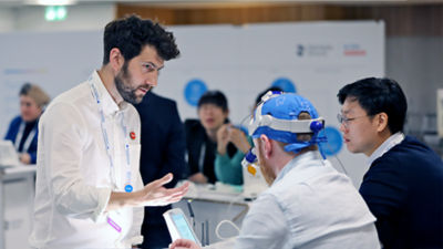 Dental professionals in discussion during hands-on training or clinical workshop