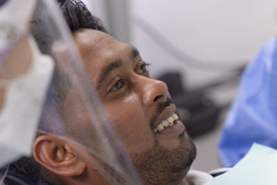 Dentist examining patient’s tooth during endodontic diagnostic procedure