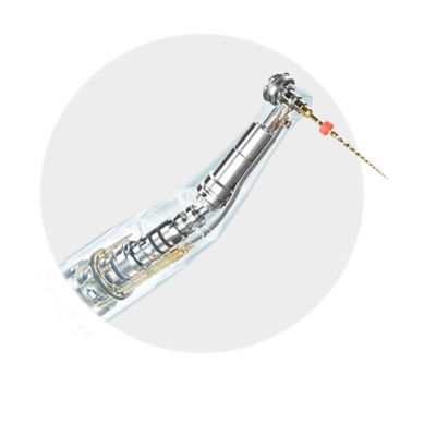 Endodontic file held by mechanical arm illustrating responsive control during root canal treatment.