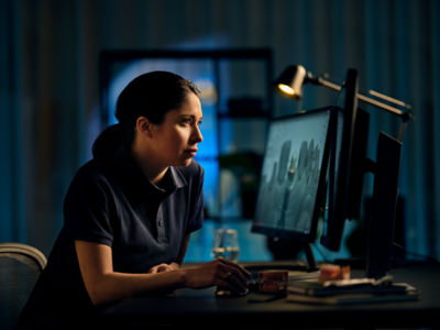 Woman in front of computer CAMS