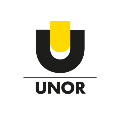 Front of Dentsply Sirona office building with trees and hedges in foreground.