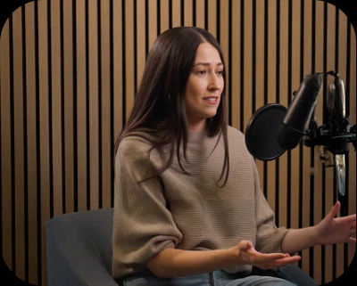 Woman speaking on podcast