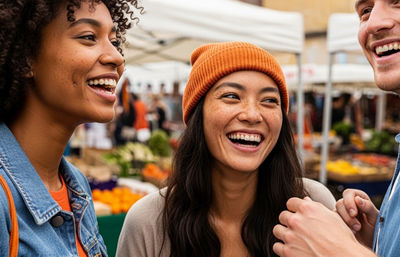 Friends laughing at market