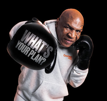 Mike Tyson in a grey hoodie throwing a punch towards the camera, with the words "WHAT'S YOUR PLAN?" written in silver on his black boxing glove.