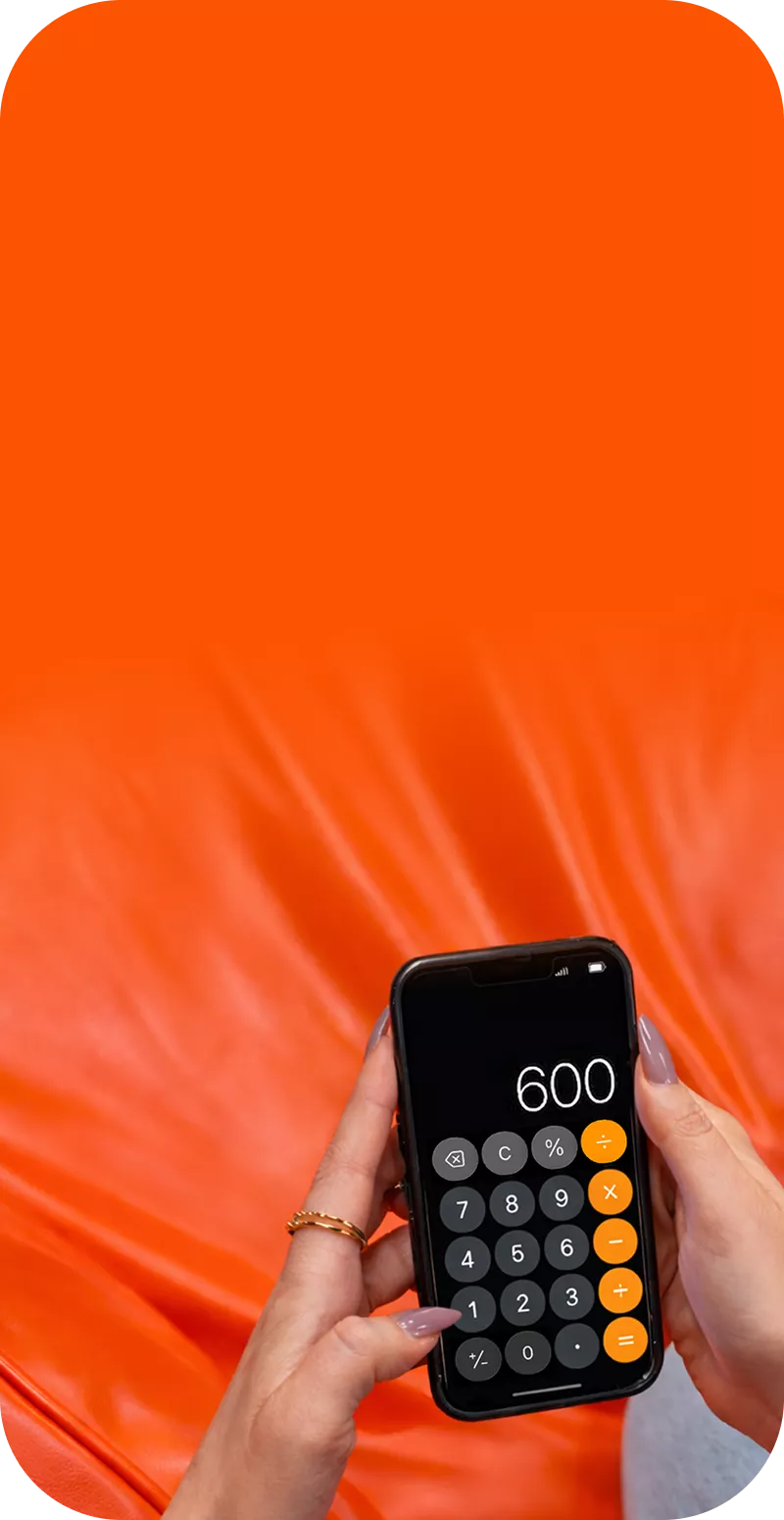 Woman using the calculator on her phone