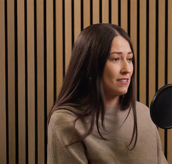 Woman speaking on a podcast