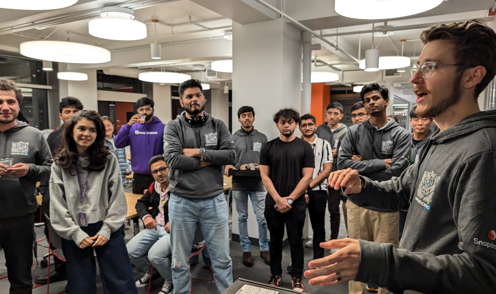 A group of people standing in a room
