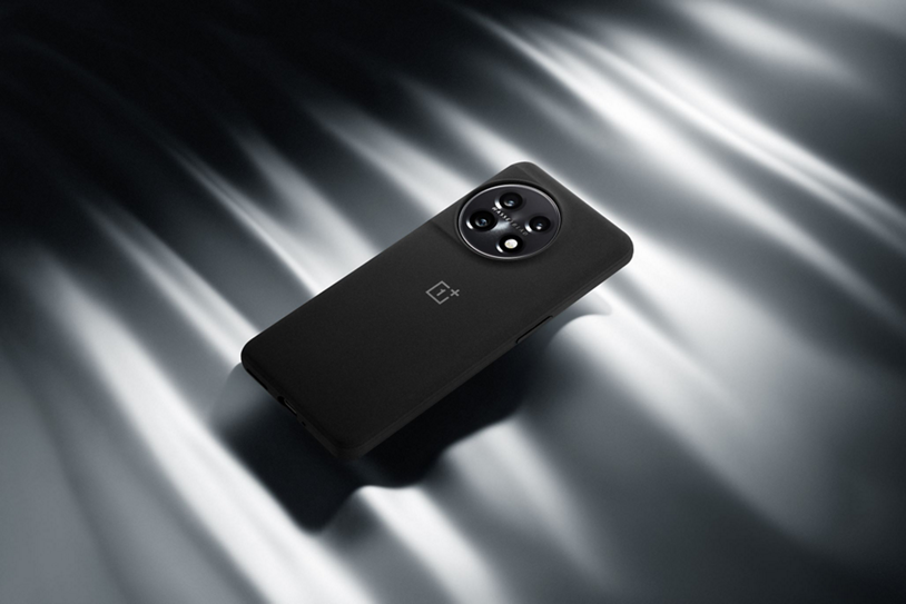 Black OnePlus 11 5G smartphone against textured background.