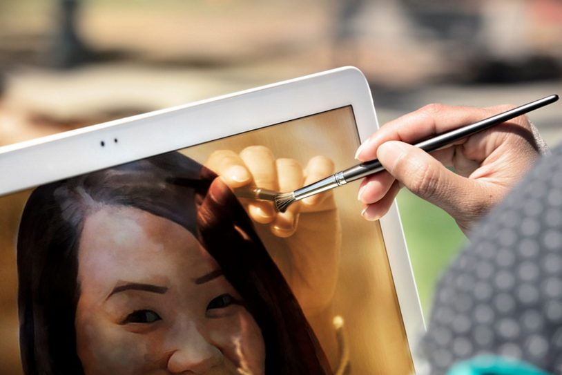 A person paints on their tablet with generative AI tools.