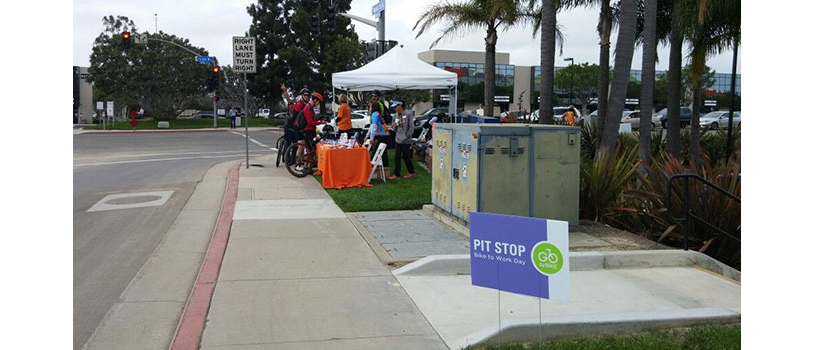Employees and community members at Qualcomm’s Bike-to-Work Day pit stop in San Diego.