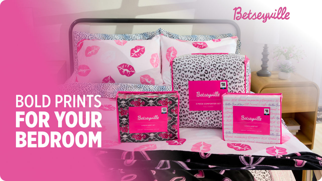 Betseyville bedding sets with bold pink patterns displayed on a bed, with packaging and promotional text reading “Bold Prints for Your Bedroom.”