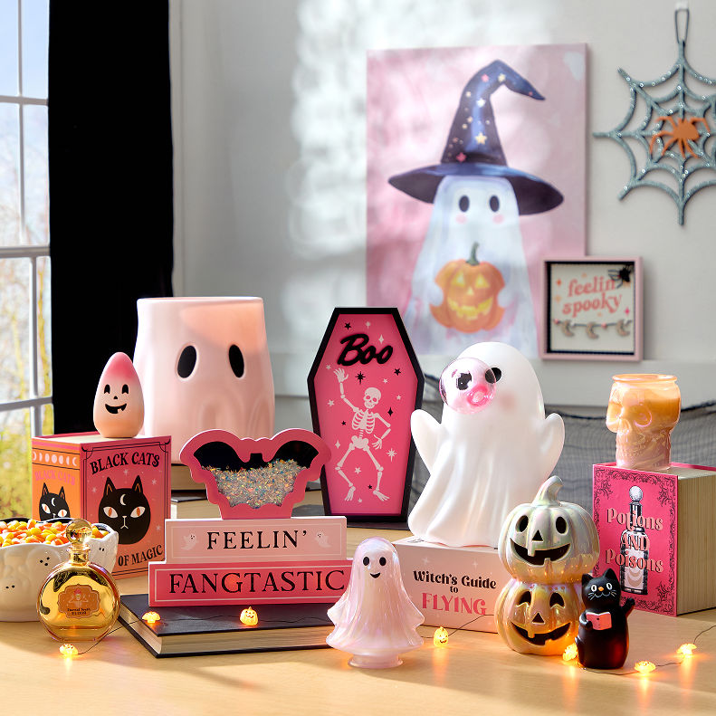 Halloween décor collection featuring ghost, pumpkin, and witch-themed tabletop decorations