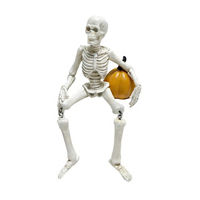 Large Seated Skeleton with Dangle Legs and Pumpkin