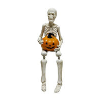 Seated Skeleton with Dangle Legs and Pumpkin, 12