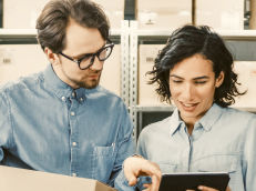 Business owners reviewing items on their laptop.