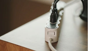 Plug plugged into power strip