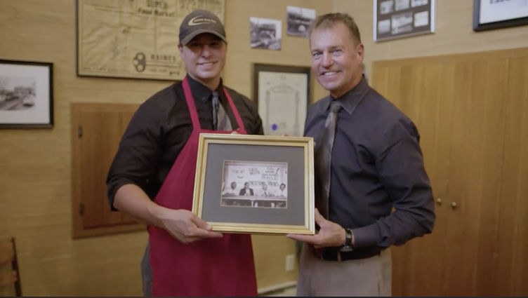 Grocery store employees accepting an award