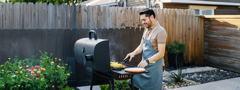 Man barbecuing on outdoor grill