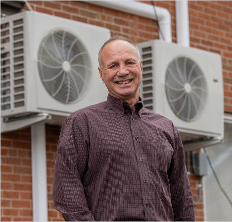 Apartment Owners standing in front of HVAC system outdoors