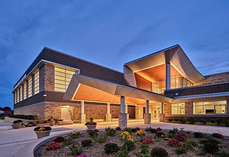 Exterior view of school lit up at night