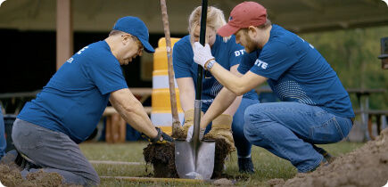 Group of DTE employees planting a tree