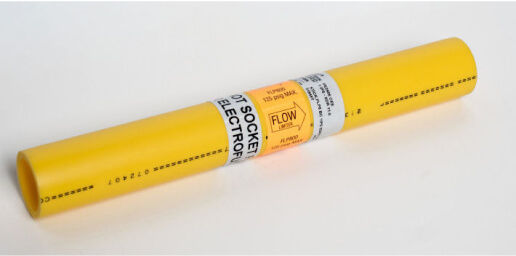 A yellow polyethylene pipe labeled for hot socket electrofusion welding, with a flow direction arrow and markings indicating it is used for gas distribution.