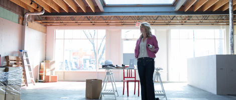 woman standing in a modern office setting