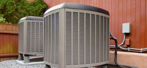 a set of air conditioners on the side of a building