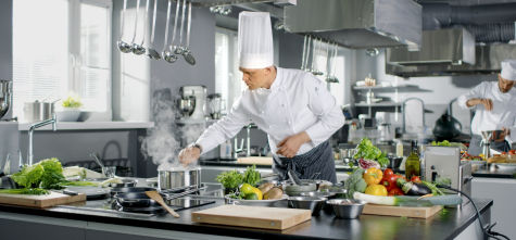 Chef working at a station in a restaurant's  kitchen