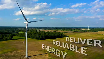 Deliver reliable energy image with windmill in farmland field