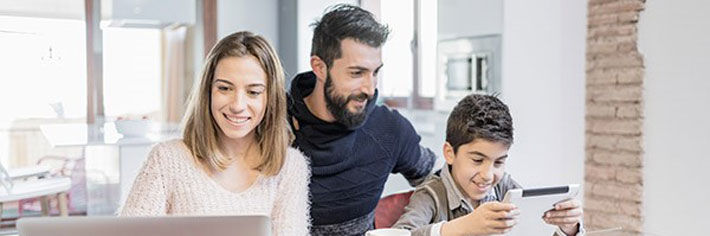 Family with Ipad in home