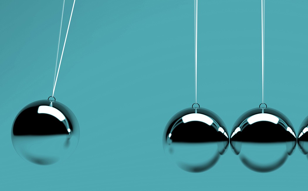 four metal balancing balls