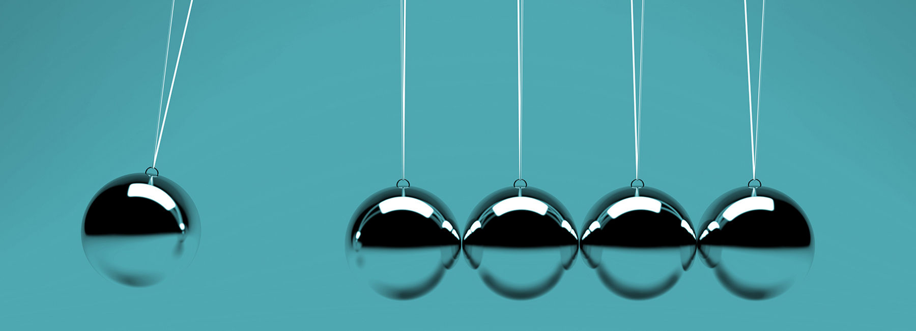 Newton's cradle of metal balls on wire tapping each other, Consulting & Engineering Services | DXC Technology Insights