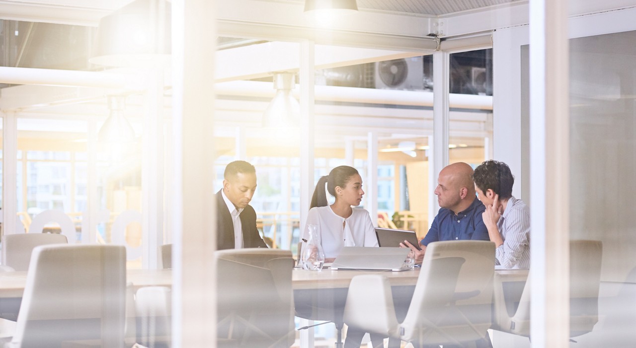 business meeting in office, hiring challenges, Business process services: Life and wealth | DXC Technology Insights