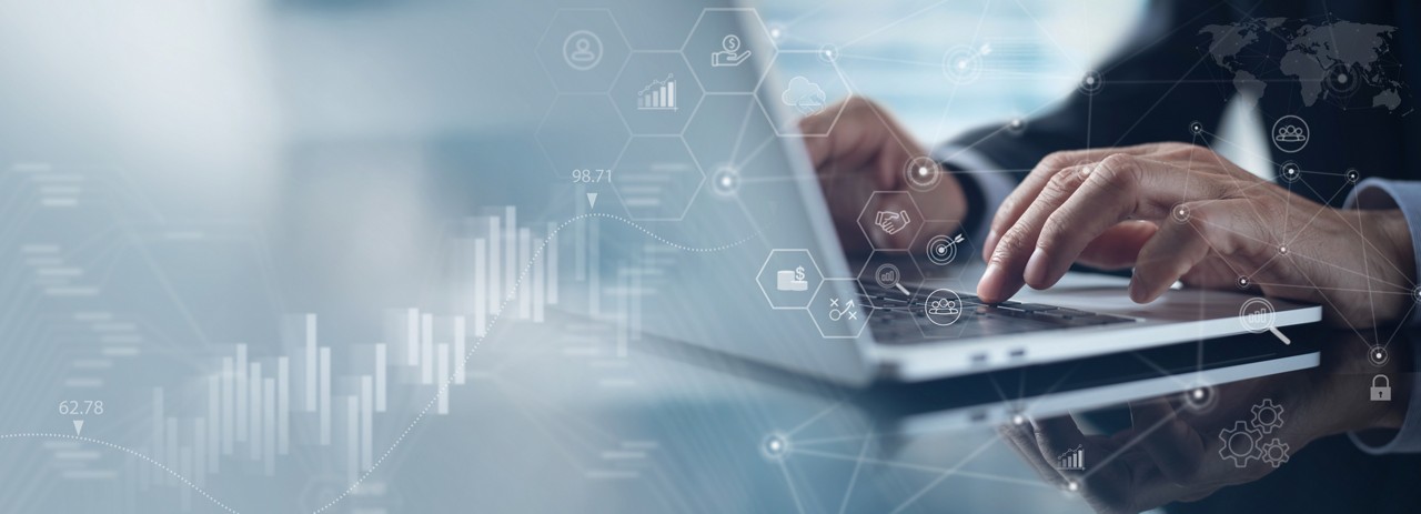 Businessman working on laptop, highlighting technology modernization, enhanced UI/UX and client intelligence, Financial Services | DXC Technology Insights