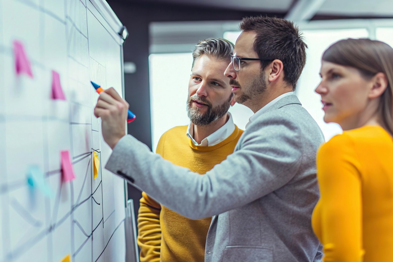 businesspeople mapping out workflow, Private AI | DXC Technology Insights